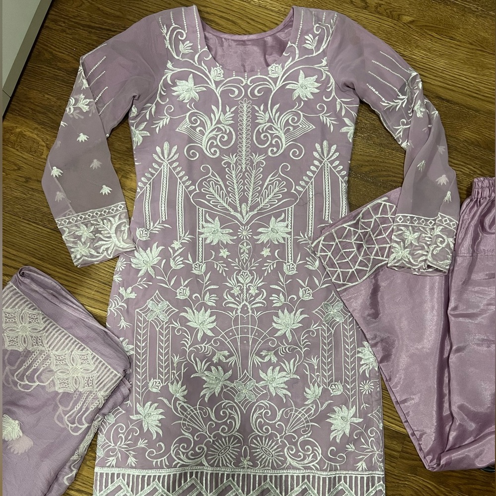 Elegant embroidered three piece Pakistani purple suit